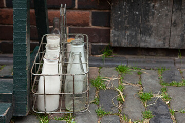 Fresh milk in recyclable glass pint bottles delivered to the door step by a traditional milk man
