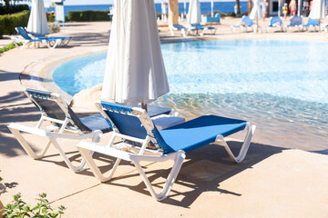 Fototapeta premium Swimming pool, sunbeds, water surface