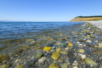 Beach and headland at Ebey's Landing with Puget Sound under a blue summer sky
