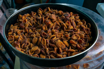 Apricot harvesting. Drying apricots, dried apricots in an electric dryer at home. Organic fruits. Healthy food. Ripe apricots. a series of pictures.