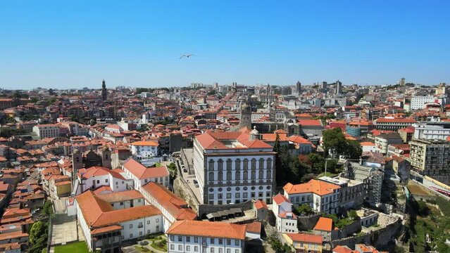 A camera drone flies away from the Episcopal Palace (former bishops' residence) and Porto Cathedral