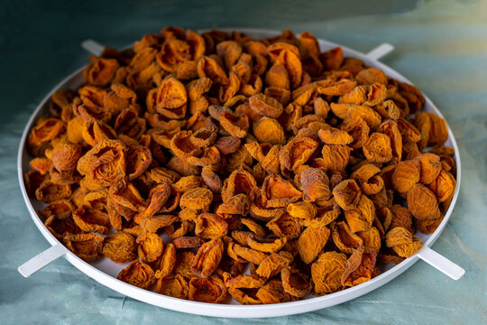 Apricot harvesting. Drying apricots, dried apricots in an electric dryer at home. Organic fruits. Healthy food. Ripe apricots. a series of pictures.
