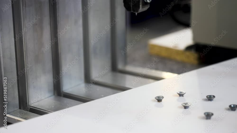 Poster machine twisting nails. media. close-up of automated machine twisting nails. production machine that