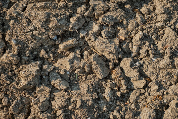 Plowed field, arable land after harvest, top view, background or screensaver idea about earth ecology and soil erosion. Growing eco-products.