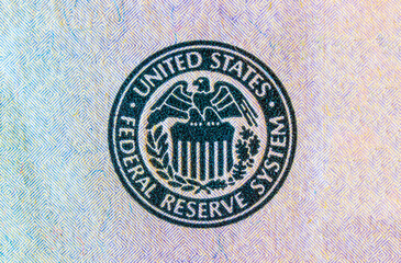 Federal Reserve System seal. The Fed's responsibilities include setting interest rates, managing the money supply, and regulating financial markets.