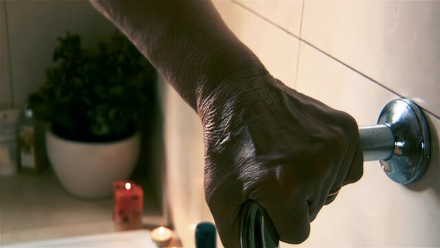 Elderly Woman Holding Bathroom Safety Grab Bar, Senior Fall Prevention Concept - 4K