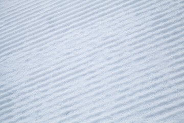 Striped texture of ski slope snow