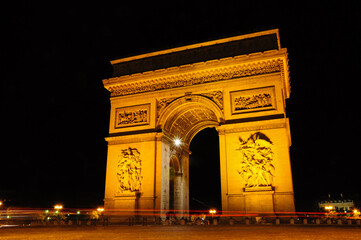 Night shot of the Arch of the Triumph in Champs Elysee, Paris, France.