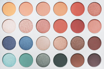 Selective focus of eyeshadow palette with various colors in pearly and matte closeup