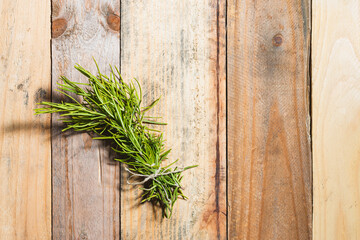 Rosemary branches on wooden boards