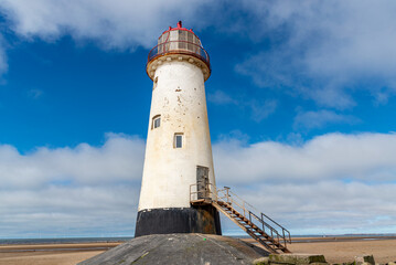 Fototapeta na wymiar Beach in sunny day small, Talacre in Wales, view lighthouse.