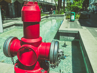 bright, red fire hydrant. water to extinguish fires on the street. a large metal fire hydrant next...