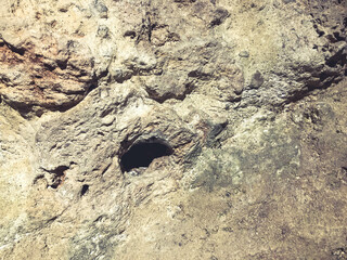 texture. cave made of stone with a hole. wall with scuffs and damage. 3d volumetric texture, background