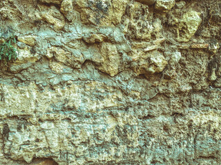volumetric texture, dark, black stones on the wall. hard, reliable material for building a cave. marble and stone board