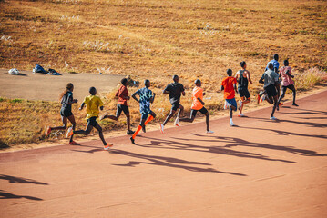 Kenyan marathon runners train at the athletics track in the town of Eldoret near Iten, the center...
