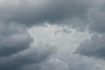 Stormy rain big fluffy clouds. Dark sky. Natural scenic abstract background. Weather changes backdrop. Sky filled with voluminous clouds.
