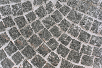 Background, texture of gray square tiles, paving stones, stone. Photo, top view.