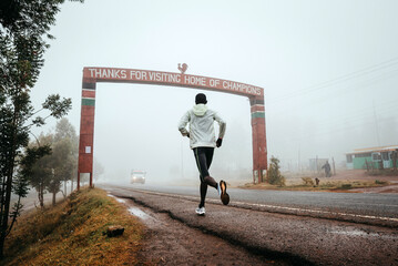 Runner with the inscription Thanks for visiting Iten, home of Champions, running training in Kenya....