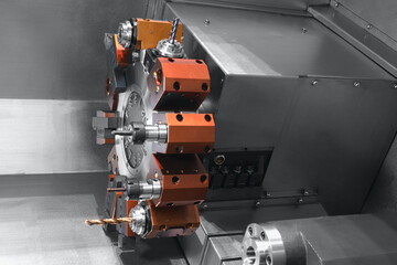 Manufacturing CNC professional lathe machine. Industrial concept. Close-up, industrial metalworking concept