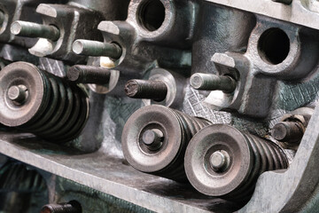 Disassembled car engine without cylinder head. Repair of an old turbocharged diesel engine in a car workshop. Close up.