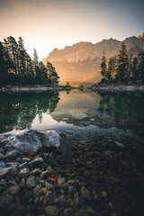 Mountain Lake Eibsee at Sunrise during Summer with a perfect Reflection
