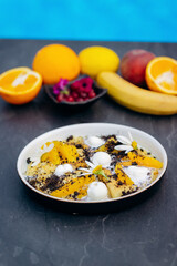 Sweet pancakes with ice cream, chocolate and orange served on white plate. Healthy and tasty breakfast
