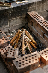 A campfire prepared to get lit for the night.