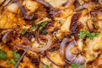 Tasty closeup of a smoking hot pizza.