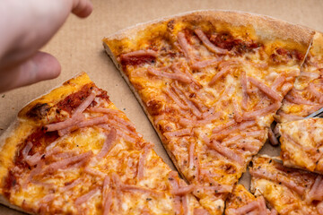 Tasty closeup of a smoking hot pizza.