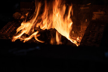 Long exposure image of a campfire burning at night.