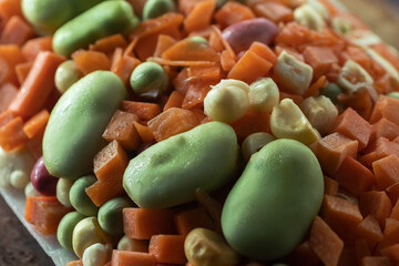 Tray of different peasant vegetables beans-carrot-peas-carrot- carrot-curly corn