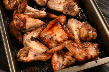 appetizing chicken wings grilled barbecue with spices and vegetables until crisp