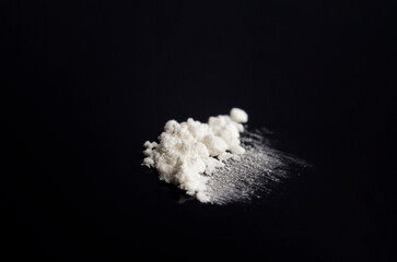 White drug on a black background
