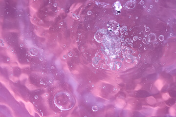 Abstract background. The texture of the waves on a blue background. Bubbling water, splashes and drops.