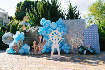 photo zone and decorations for the holiday in marine style in the fresh air.
