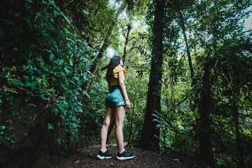 woman walking in the middle of the jungle