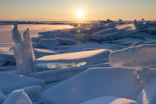 snowed ice blocks over frozen lake