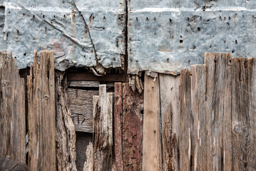 An old repaired fence of wood and metal, somewhere in the town of Amalfi