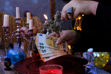 seance in salon of soothsayer, Librate with money, female hands of psychic doing witchcraft passes...