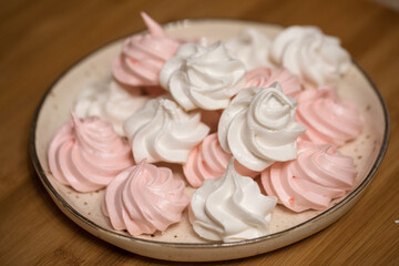 Pink white zephyr on plate, homemade dessert from ecological ingredients 