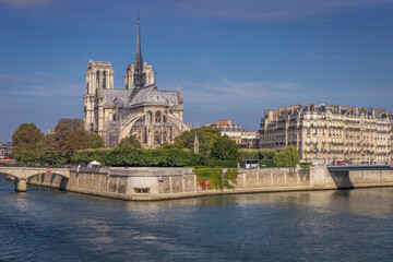 Fototapeta na wymiar Notre Dame Cathedral of Paris and Seine river at sunny day, France
