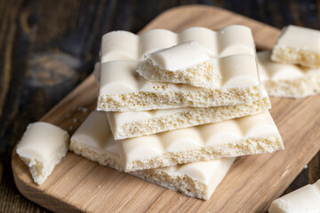 white porous chocolate on a wooden table