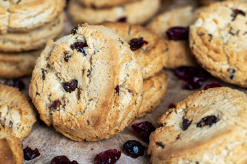 delicious dried cookies made of high-quality flour with dried red cranberries on the table