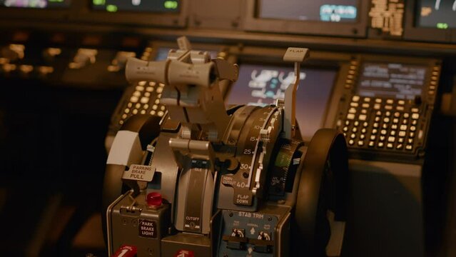 Control panel dashboard with handle or lever to throttle engine and takeoff with airplane. Power buttons and switch in cockpit to command navigation, flying on radar. Close up.