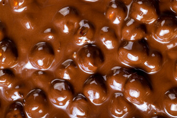 real milk chocolate while cooking with hazelnuts