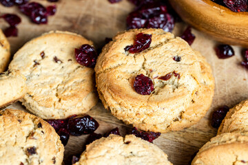 delicious dried cookies made of high-quality flour with dried red cranberries on the table
