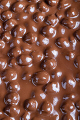 real milk chocolate while cooking with hazelnuts