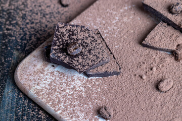 broken into pieces of milk and dark chocolate bars