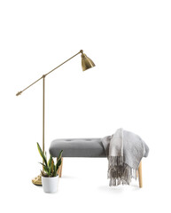 Fototapeta na wymiar Soft bench with plaid, houseplant and lamp on white background
