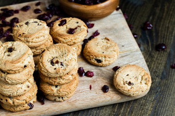 delicious dried cookies made of high-quality flour with dried red cranberries on the table